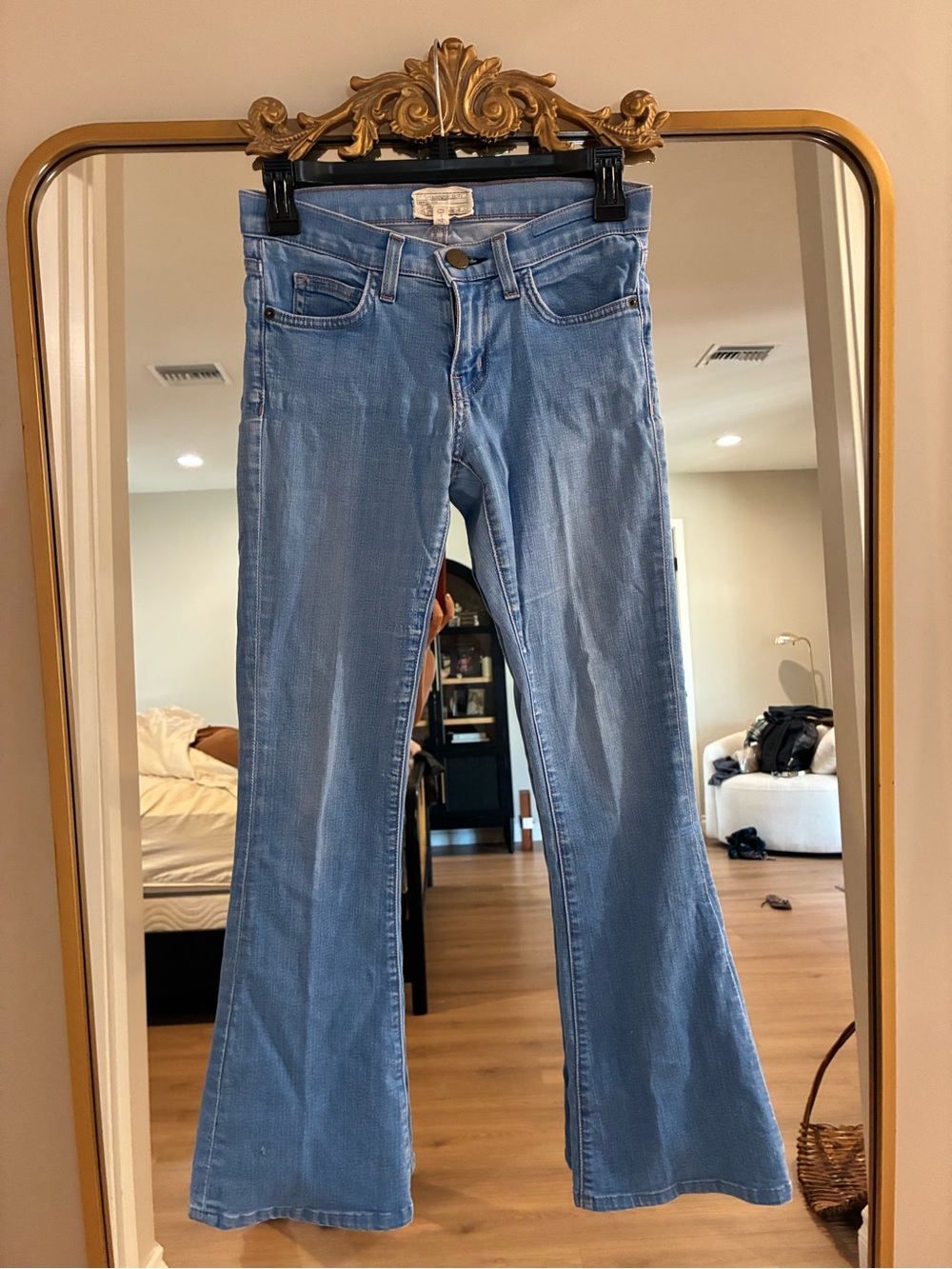 Current/Elliott light wash low-rise flare jeans.